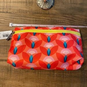 NWT Clinique cosmetic bag. Orange, blue, pink w/yellow zipper. 8”x5”x2.5” $10